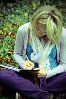 Reader Writing a Review of The Reborn