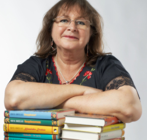 Kim M. Kimselius and some of her 26 books. Photo by Bertil Knoester.