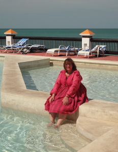 Kim enjoying the pool water in Mexico during a study trip for one of her books.