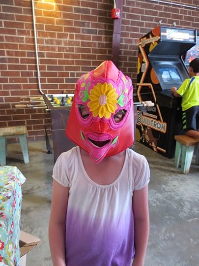 child in lucha libre mask