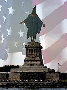 The notorious hooded man from Abu Ghraib replaces the Statue of Liberty in this powerful image.