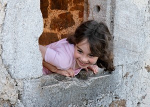http://www.dreamstime.com/royalty-free-stock-images-smiling-girl-castle-window-image8536909