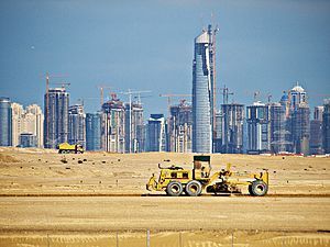English: Towers rise from the sand at the peak...