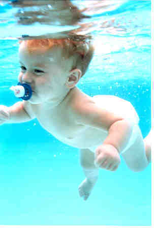 baby swimming with pacifier