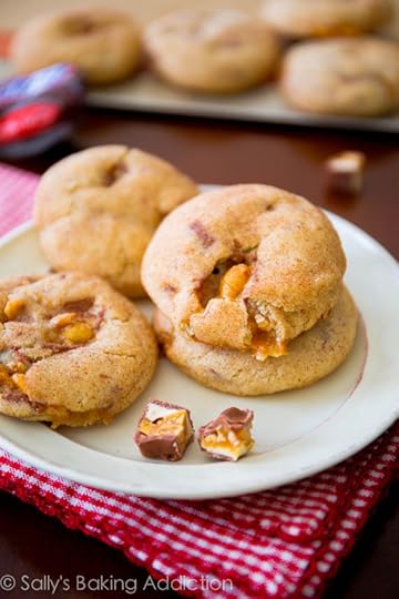 Soft-baked & chewy Snickerdoodle Cookies stuffed with gooey, melty Snickers Bars. Ready in less than 30 minutes! sallysbakingaddiction.com