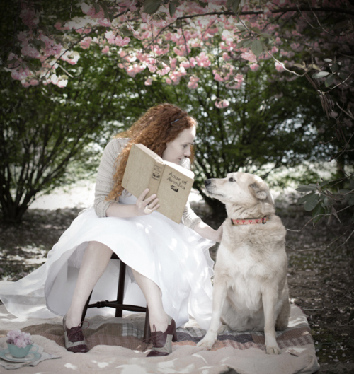 (Karen's caption): My favorite photo of me with Grandma Small’s book, reading to my friend’s dog, Lola.