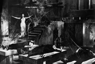 old movie still with cobwebs all over