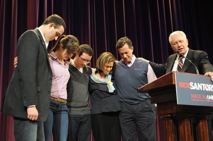 Rick Santorum and his family prayed with a pastor at a campaign rally in a Cumming, Ga., church on Feb. 19.