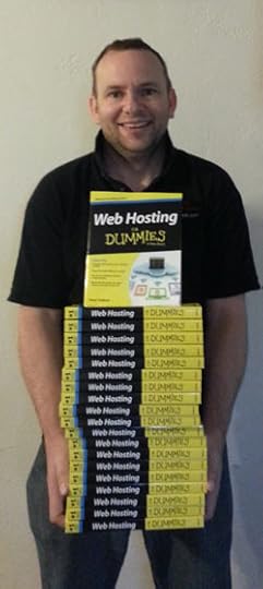 Peter Pollock holding a stack of Web Hosting For Dummies Books