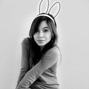 A woman wearing antenna-like rabbit ears, to represent how losing my hearing enhanced my ability to receive intuitive messages.