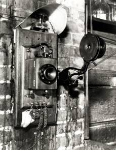 Carbon button microphone mouthpiece on phone in Edison workshop