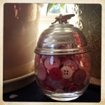 pink buttons in a pretty French condiment jar