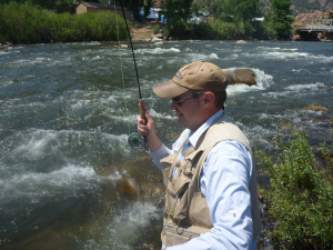 Andy battles a nice brown in the fast current 