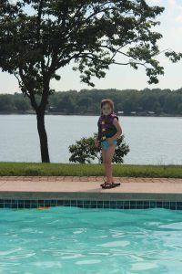 Shoe thief extraordinaire, enjoying the pool at her grandparents' house. The life jacket made my life a whole lot easier.
