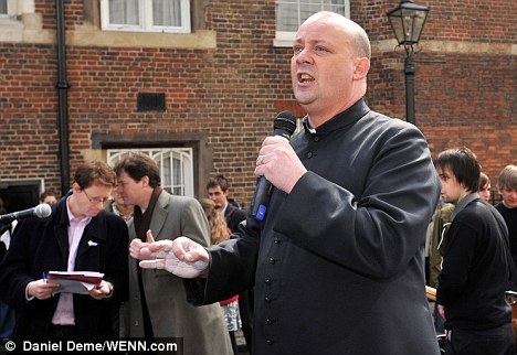 Interesting talk: Peter Hitchens sat with former Canon Chancellor Giles Fraser who was among the smokers outside St Paul's