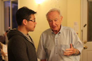 Herbert Heller talks with a student