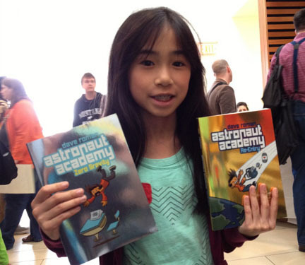 kid with two books