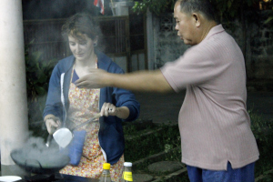 Cooking the morning glory with Maew's instruction.
