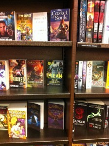 Picture of a line of books at the bookstore, with Clean (my book) at the center