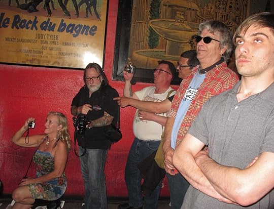 Son, far right, watches Father at Work by David Fox