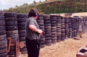 Me, when considerably younger, heavier, and happier, drawing from speed-holster. What larks!