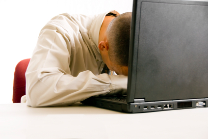 guy-head-down-on-laptop