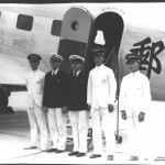 CNAC's first DC-2 crew: Hewitt Mitchell and Moon Fun Chin (with three airport porters)