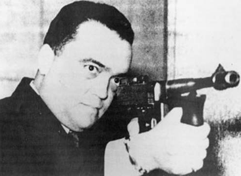 J. Edgar Hoover with machine gun - tommy gun