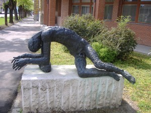 hitting the wall sculpture