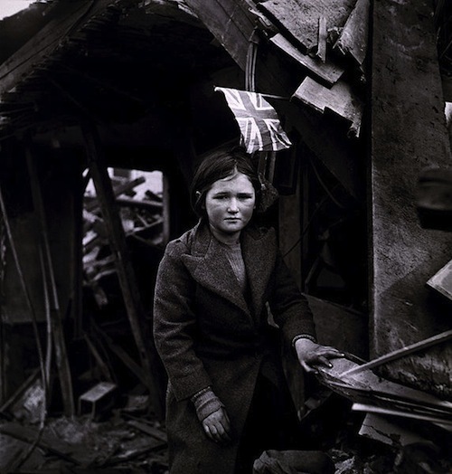 A girl standing in the ruins of Battersea in January, 1945, after a V2 raid. Photograph taken by Toni Frissell, US Women's Army Corps.