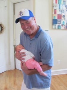 Dallin Malmgren holds his first grandchild