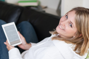 http://www.dreamstime.com/royalty-free-stock-photos-young-beautiful-woman-ebook-reader-image27020268
