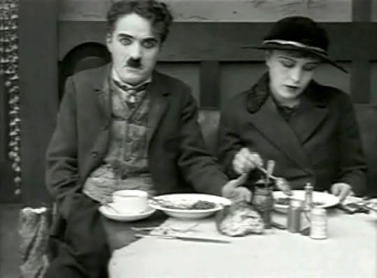 Chaplin and Purviance in the memorable restaur...