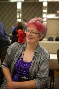 Picture of Cat Rambo with a dragon on her shoulder