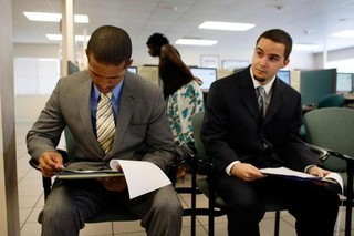  Gregory Tai (L), competes with Javier Munoz (R), for one of about fifty positions open with South Florida Workforce