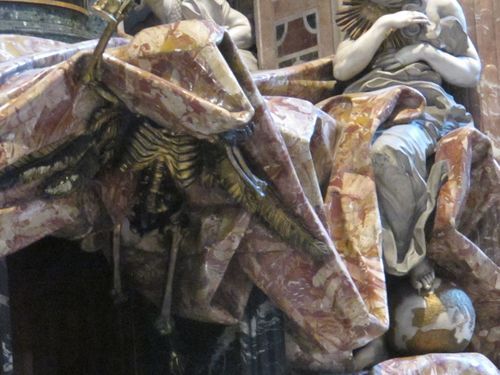 St. Peter's dome. Oh, sorry, no, that's a solid gold skeleton enfolded in a pink marble drape, at the entrance to a crypt in St. Peter's Basilica. Photo by Kim Kash.