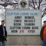 Andy and Chris at the sign announcing the reading