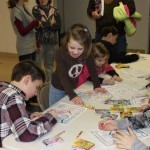 Children color during the presentation and readings