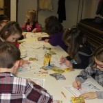 Children color during the presentation and readings