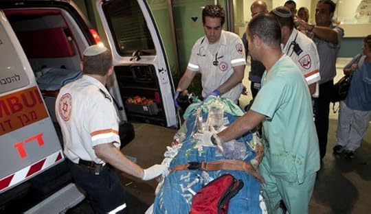 Moshe Silman being evacuated by Magen David Adom paramedics.