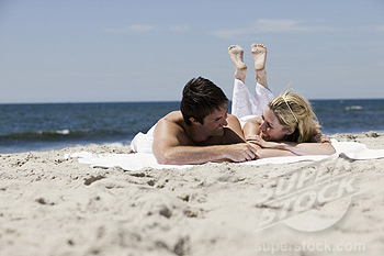Couple relaxing at a beach.