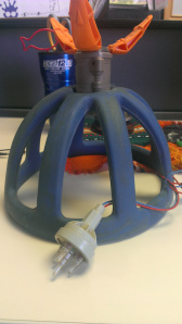 Ingredients: The inside of some sort of sports helmet, a claw attachment from an old Transformer, and a pronged light purloined from an old robot set.