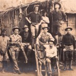 In front of a nipa hut.
