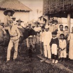 Posing with residents and a carabao.