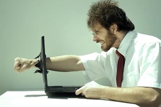 A Man Punching His Fist Through His Laptop Computer - Photo courtesy of ©iStockphoto.com/clintspencer, Image #3237600 