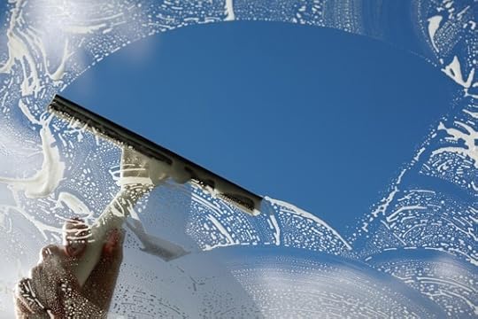 Window Cleaner Using a Squeegee to Wash a Window - Photo courtesy of ©iStockphoto.com/BrianAJackson, Image #19515449
