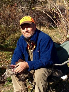 Tom Davis cleans an Idaho ruffed grouse. 