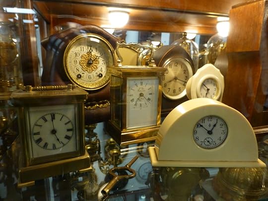 Clocks on a shelf