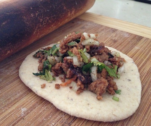 Filling the parantha with keema