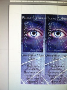 I used Microsoft Power Point to format and print the bookmarks, and in this photo you can (hopefully) see the dots across the page that will help you align the bookmarks to make them center.